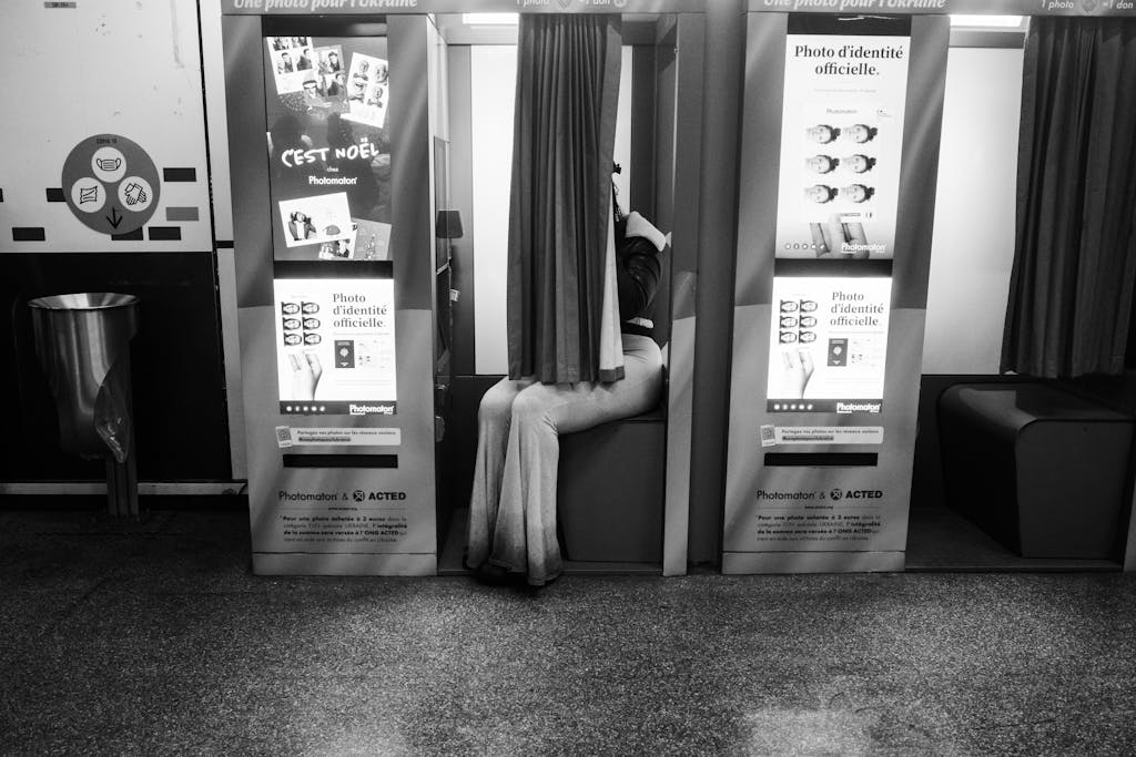 Woman Sitting in a Photo Booth