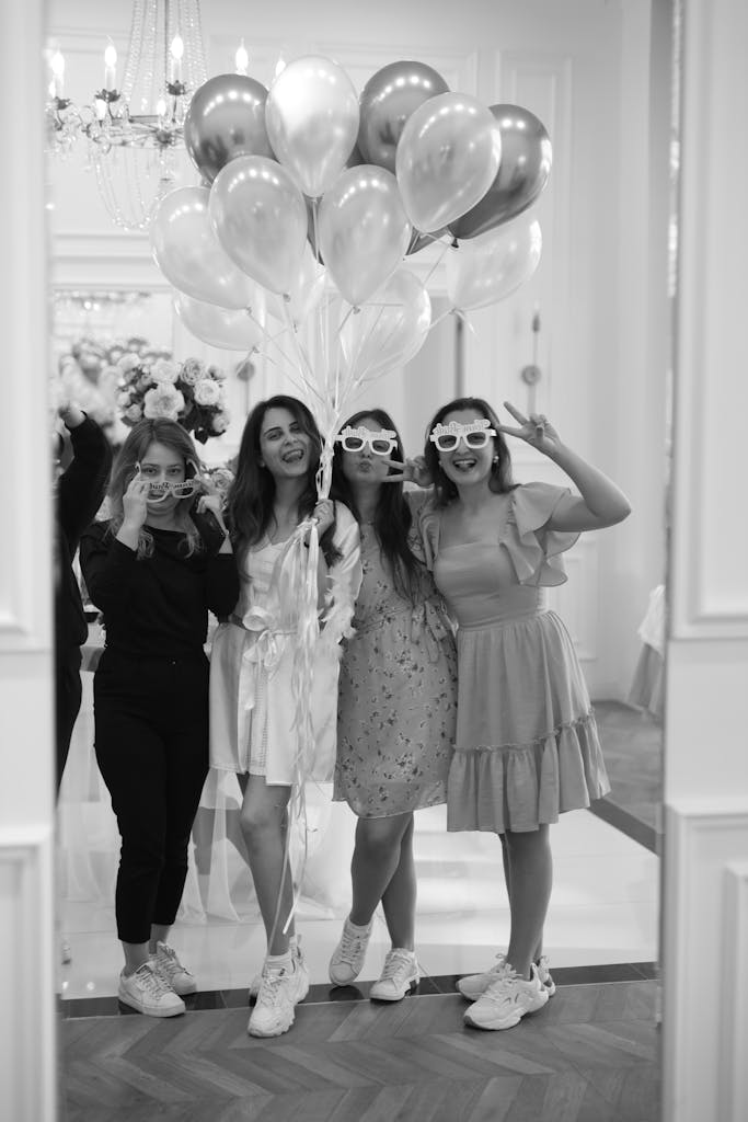 Group of Friends Celebrating with Balloons Indoors